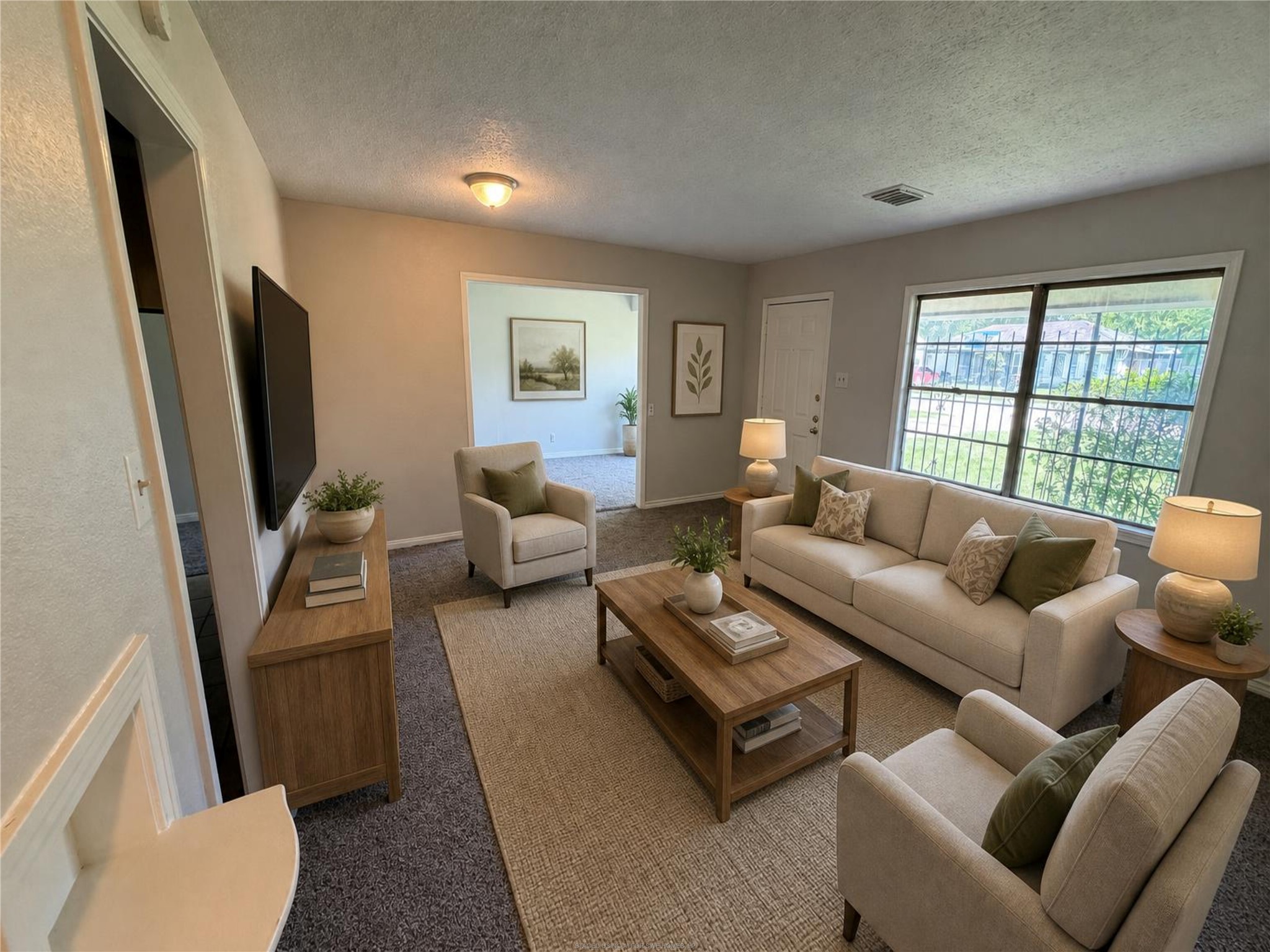 3614 Cosby Street Houston, TX 77021 - Photo 4 of 16 a living room with furniture a flat screen tv and a window