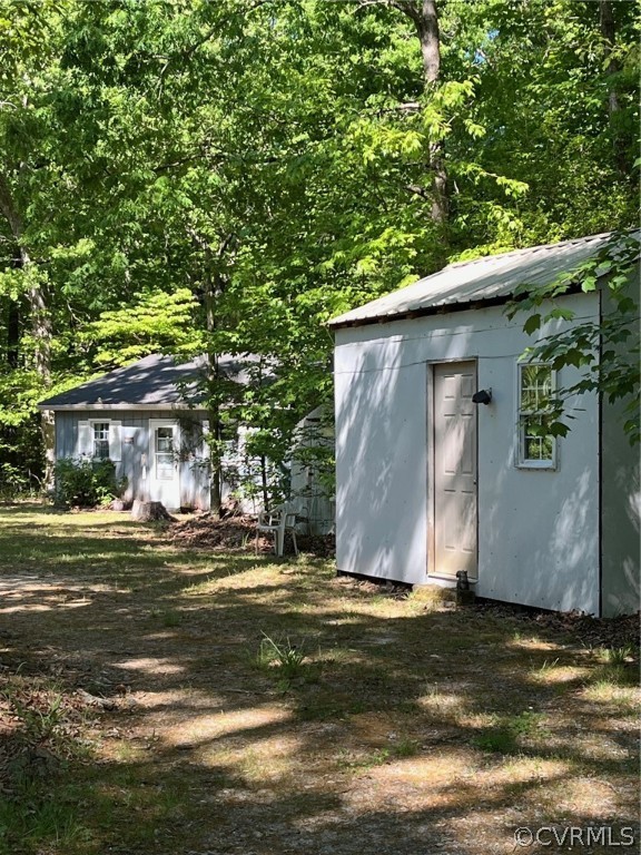 11634 Patillo Road Dewitt, VA 23840 - Photo 6 of 7 a view of a house with a yard