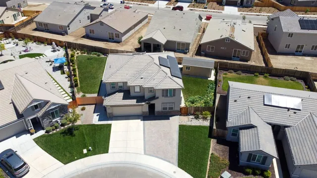 an aerial view of a house with garden