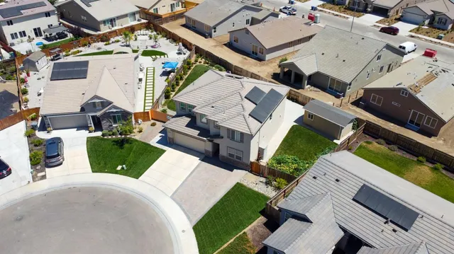 a kitchen with stainless steel appliances granite countertop a stove top oven a sink and dishwasher