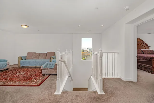 a spacious bathroom with a double vanity sink a large mirror and a shower