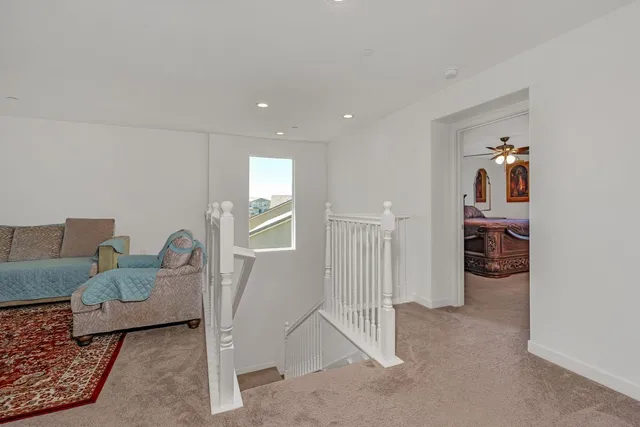 a bathroom with a toilet and a shower curtain