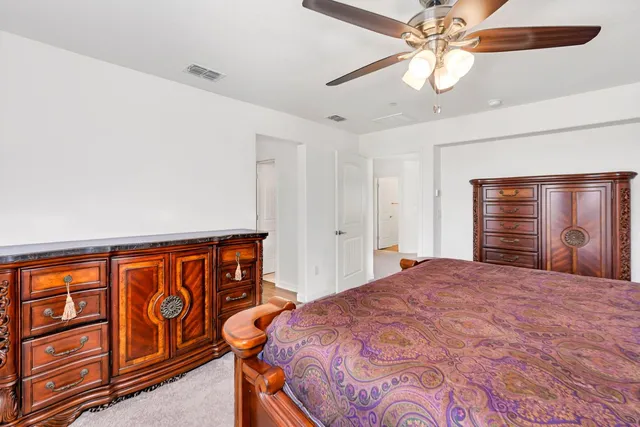 a view of walk in closet with clothes