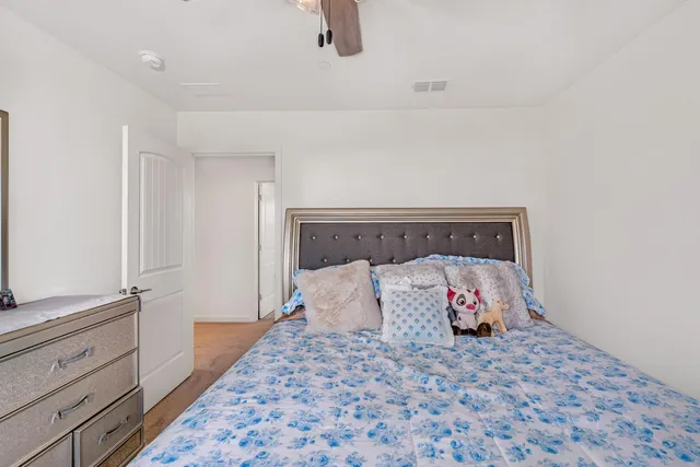 a view of walk in closet with clothes