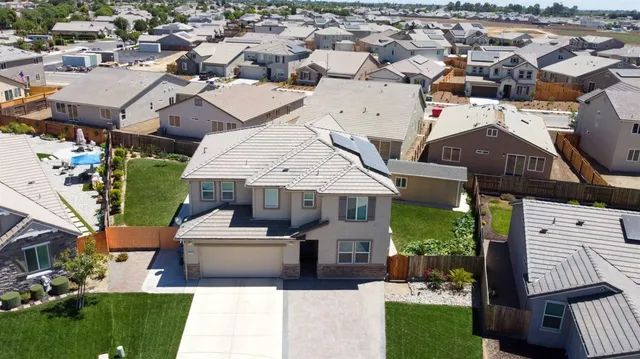 a view of house with yard and entertaining space
