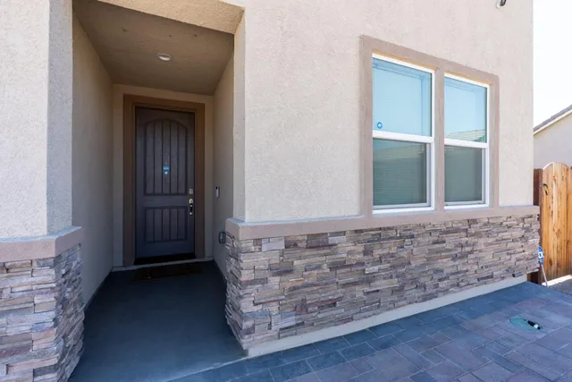 a view of front door with wooden floor