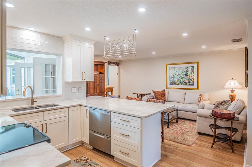 741 Brookside Road Maitland, FL 32751 - Photo 5 of 43 a view of a kitchen counter top space with sink stainless steel appliances and windows