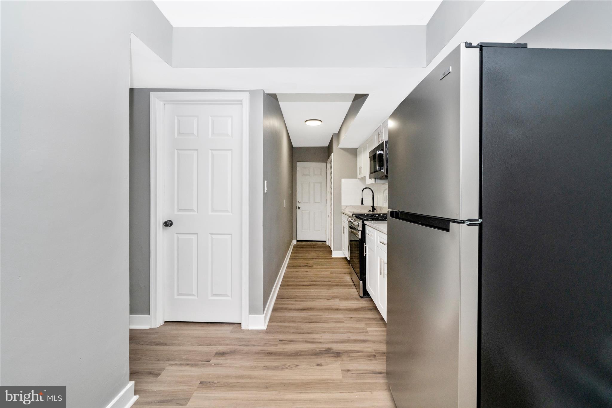 5027 Benning Road Southeast Washington, DC 20019 - Photo 14 of 57 a view of entryway with wooden floor