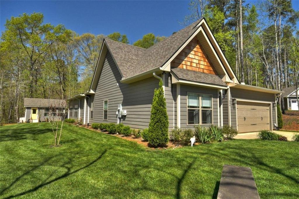 a front view of a house with a yard