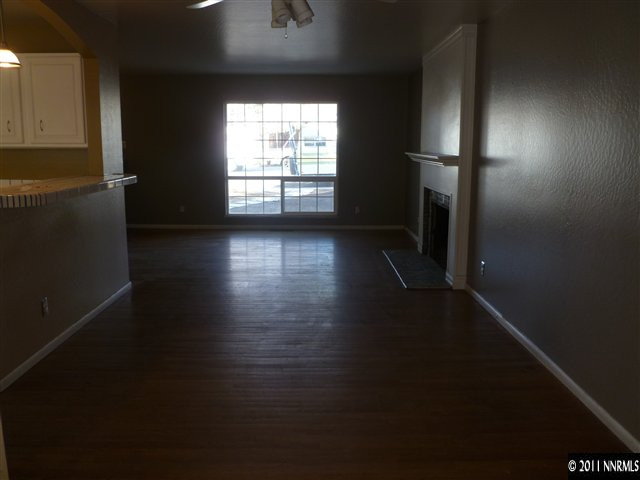 1290 Earl Drive Reno, NV 89503 - Photo 4 of 13 an empty room with wooden floor and windows