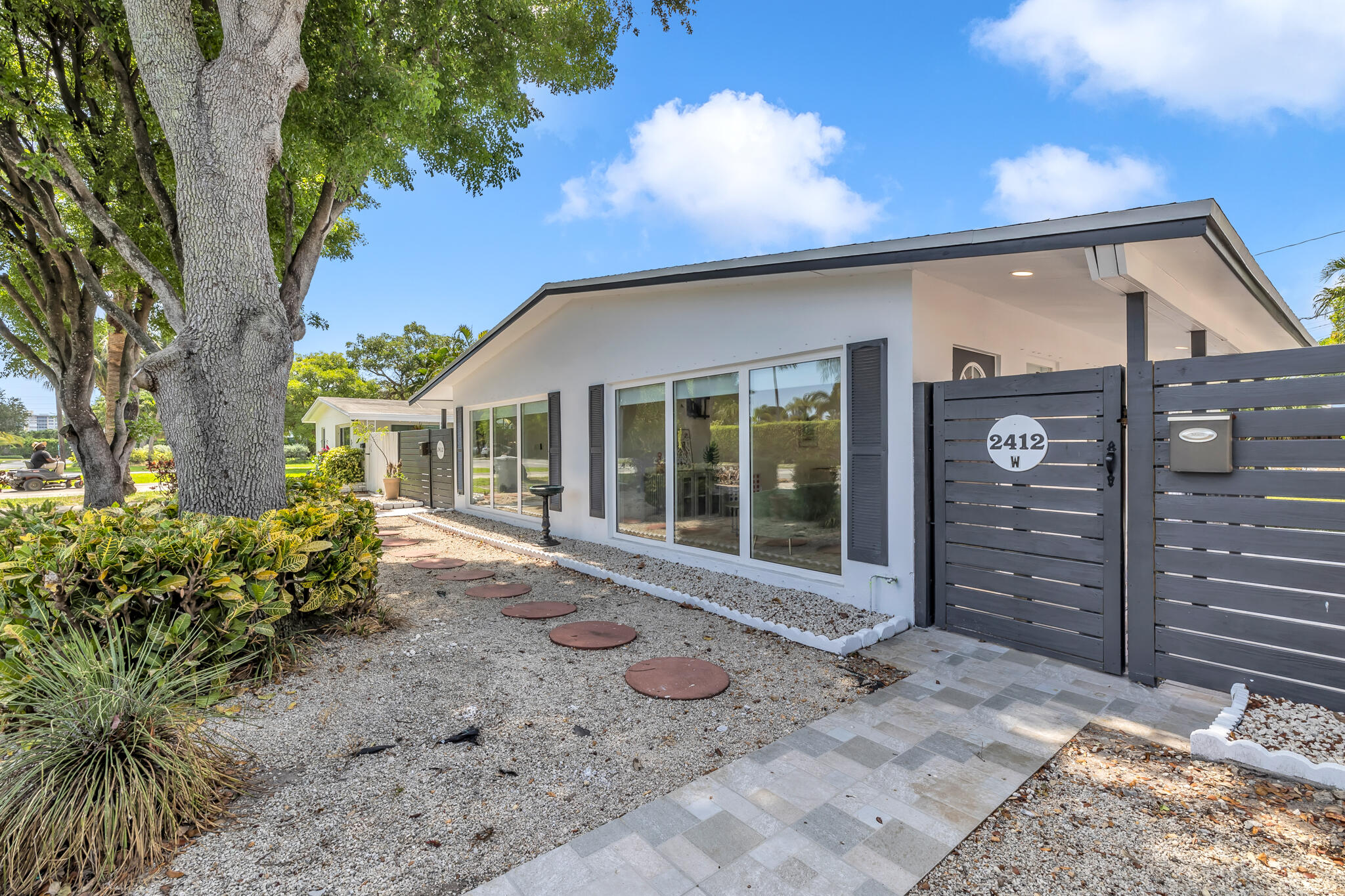 2412 Northeast 4th Street, Unit W Pompano Beach, FL 33062 - Photo 1 of 18 a front view of a house