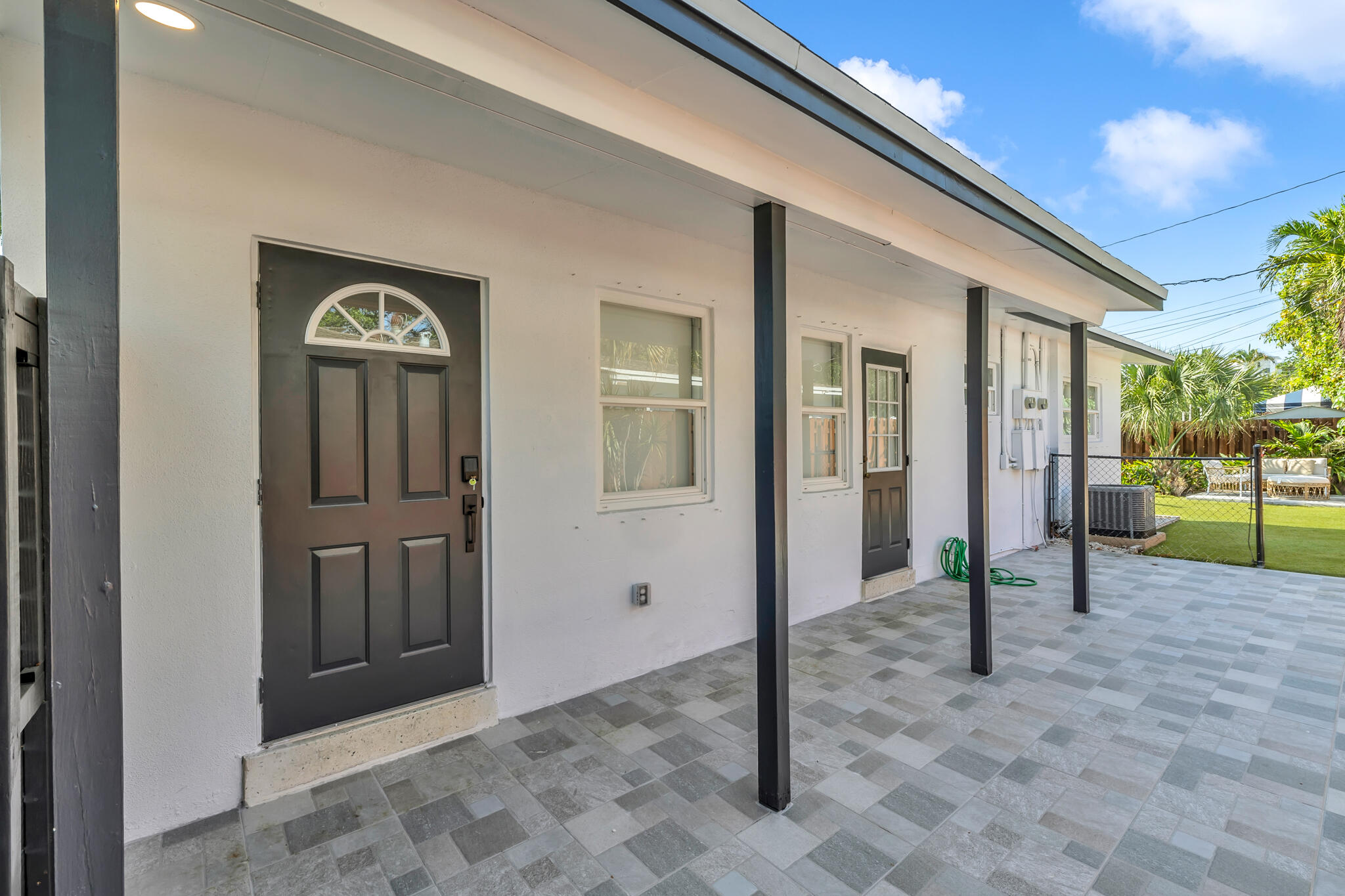 2412 Northeast 4th Street, Unit W Pompano Beach, FL 33062 - Photo 2 of 18 a view of a house with backyard of the house