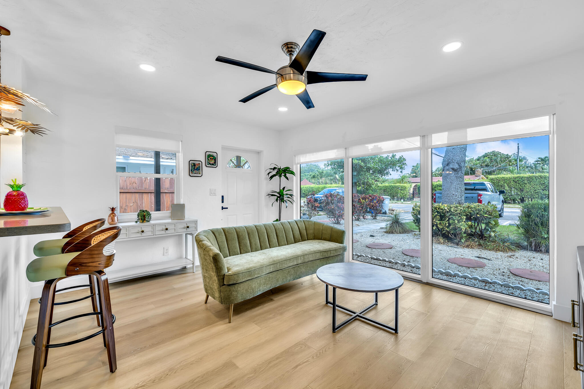2412 Northeast 4th Street, Unit W Pompano Beach, FL 33062 - Photo 6 of 18 a living room with furniture and a large window