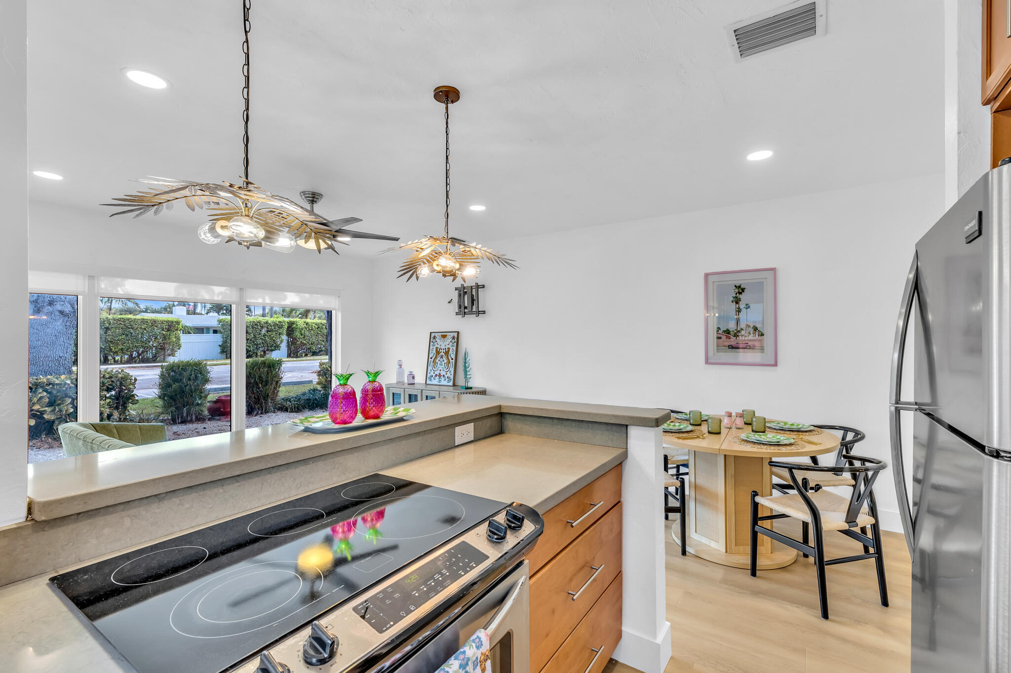 2412 Northeast 4th Street, Unit W Pompano Beach, FL 33062 - Photo 10 of 18 an open kitchen with a table and chairs