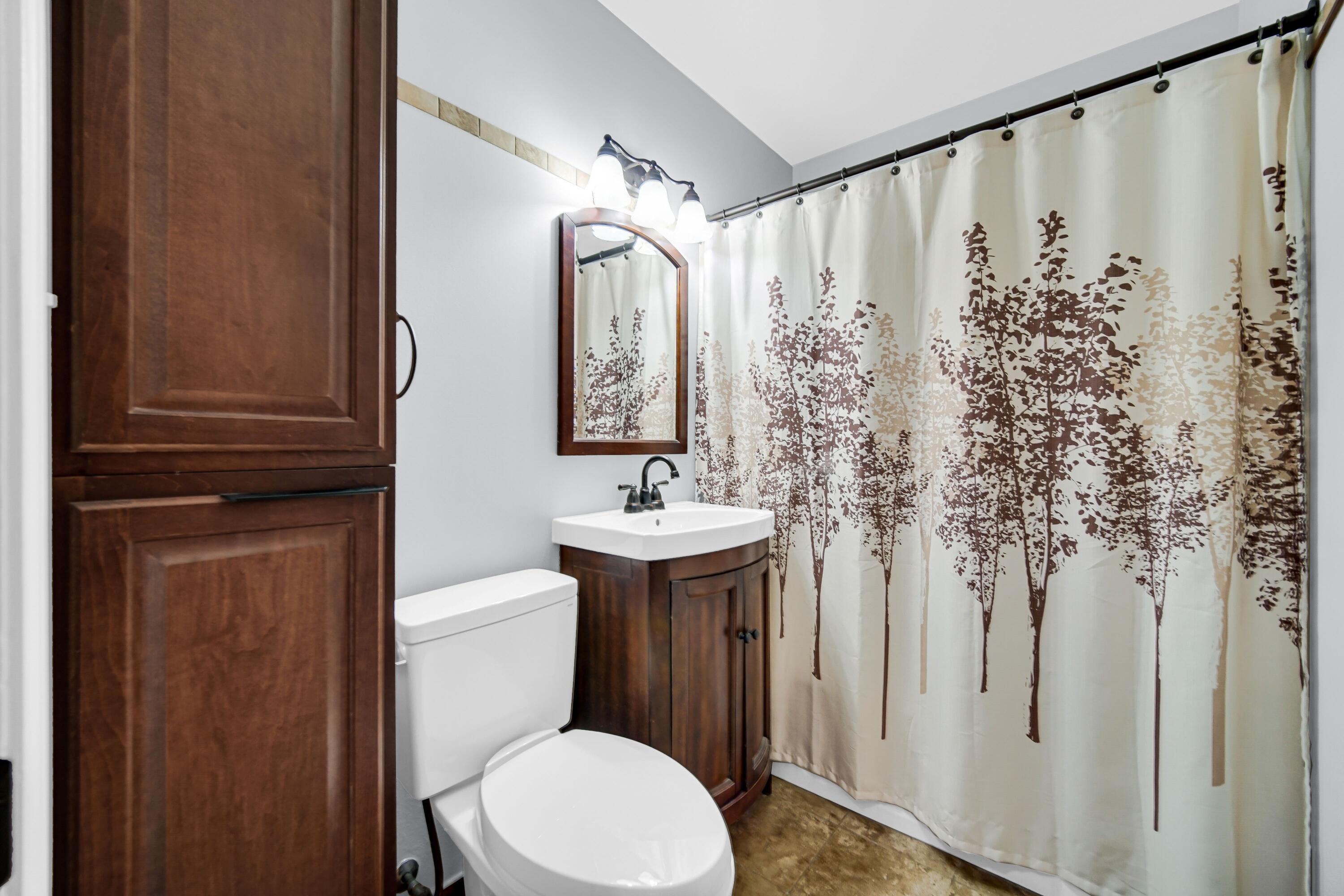 600 West North Street Crown Point, IN 46307 - Photo 14 of 24 a bathroom with a sink a toilet and shower