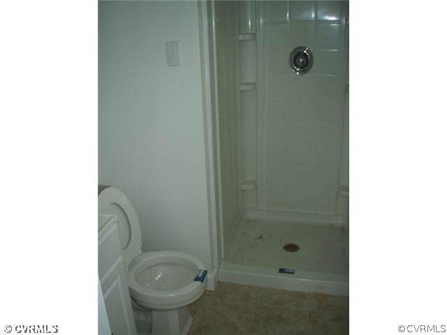 1851 Rabbit Warren Road Manakin-Sabot, VA 23103 - Photo 7 of 7 a bathroom with a granite countertop toilet and a shower