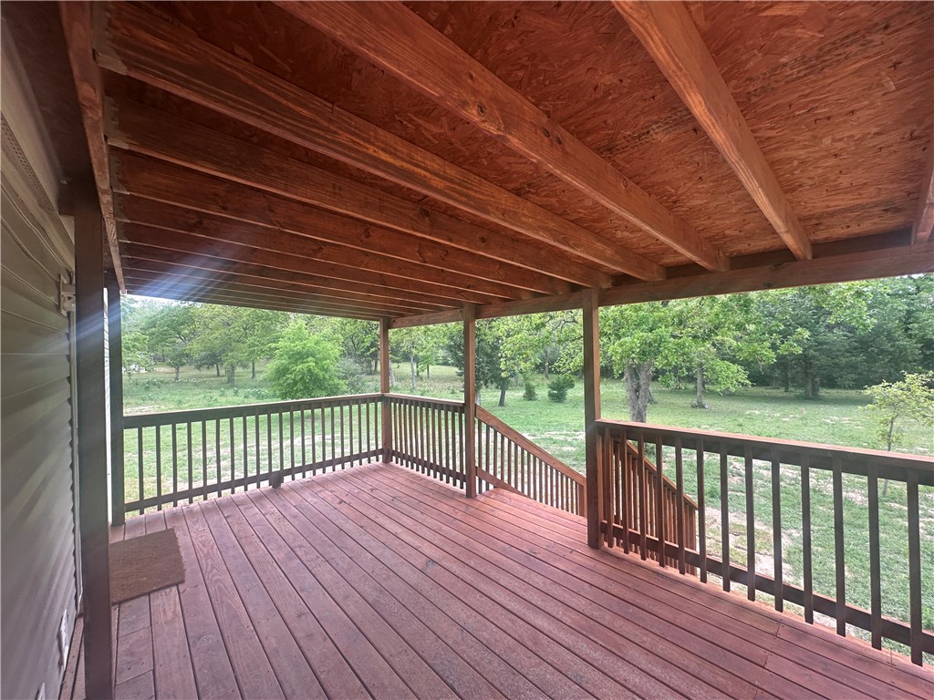 9855 Deer Ridge Lane Bryan, TX 77808 - Photo 8 of 8 a view of a wooden deck