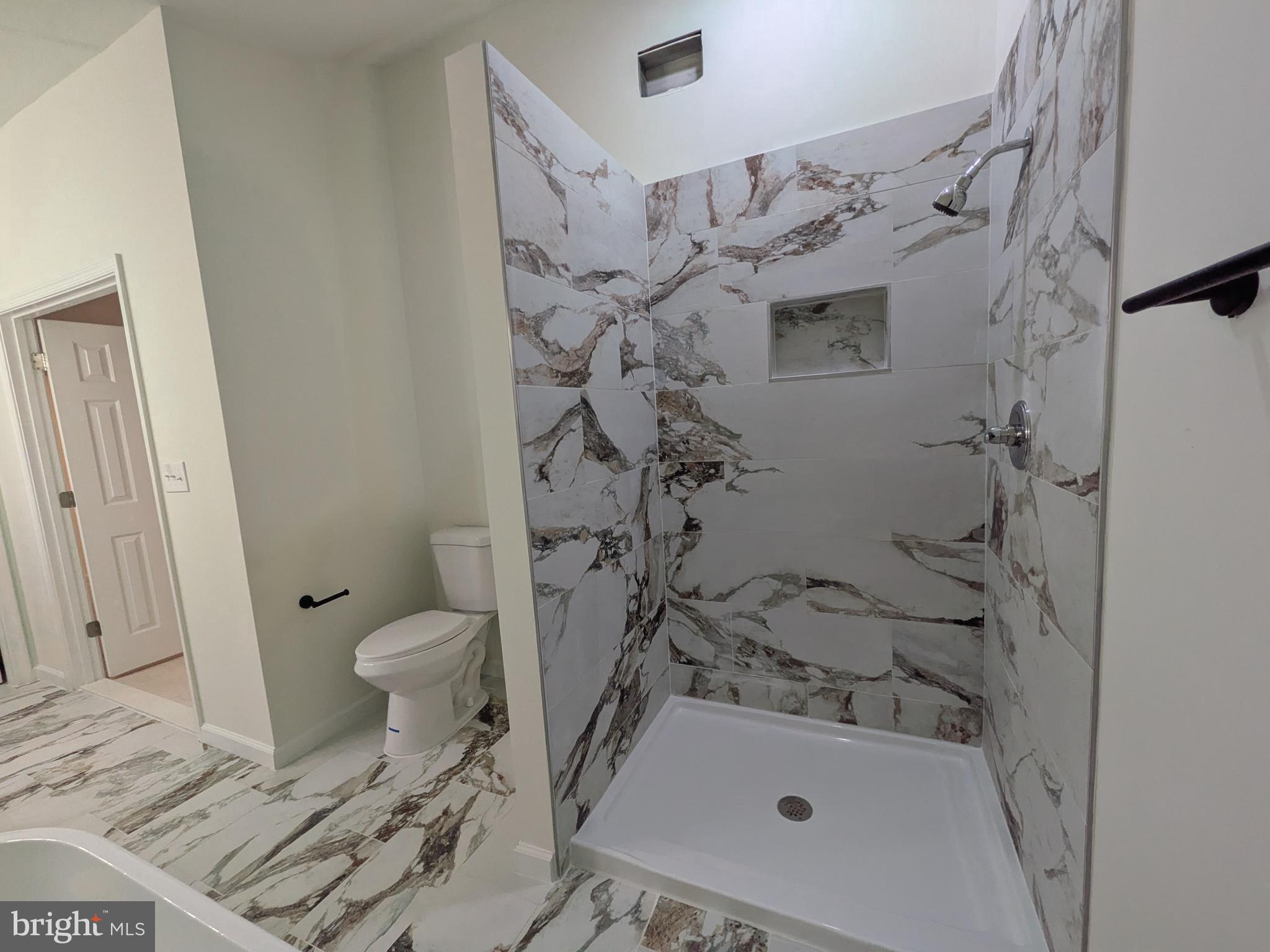 1019 Isabella Drive Stafford, VA 22554 - Photo 13 of 20 a bathroom with a sink toilet and shower