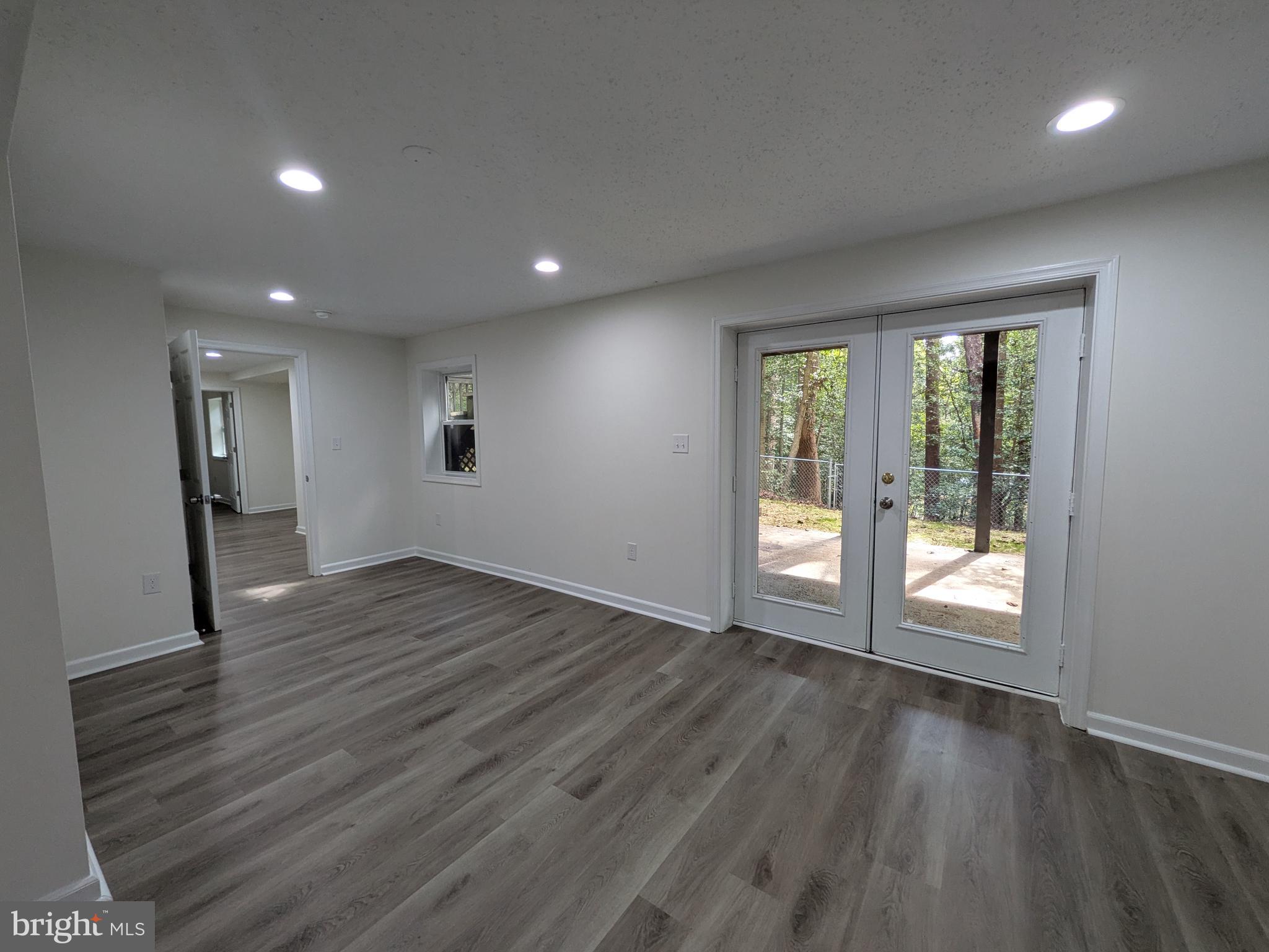 1019 Isabella Drive Stafford, VA 22554 - Photo 19 of 20 an empty room with wooden floor and windows