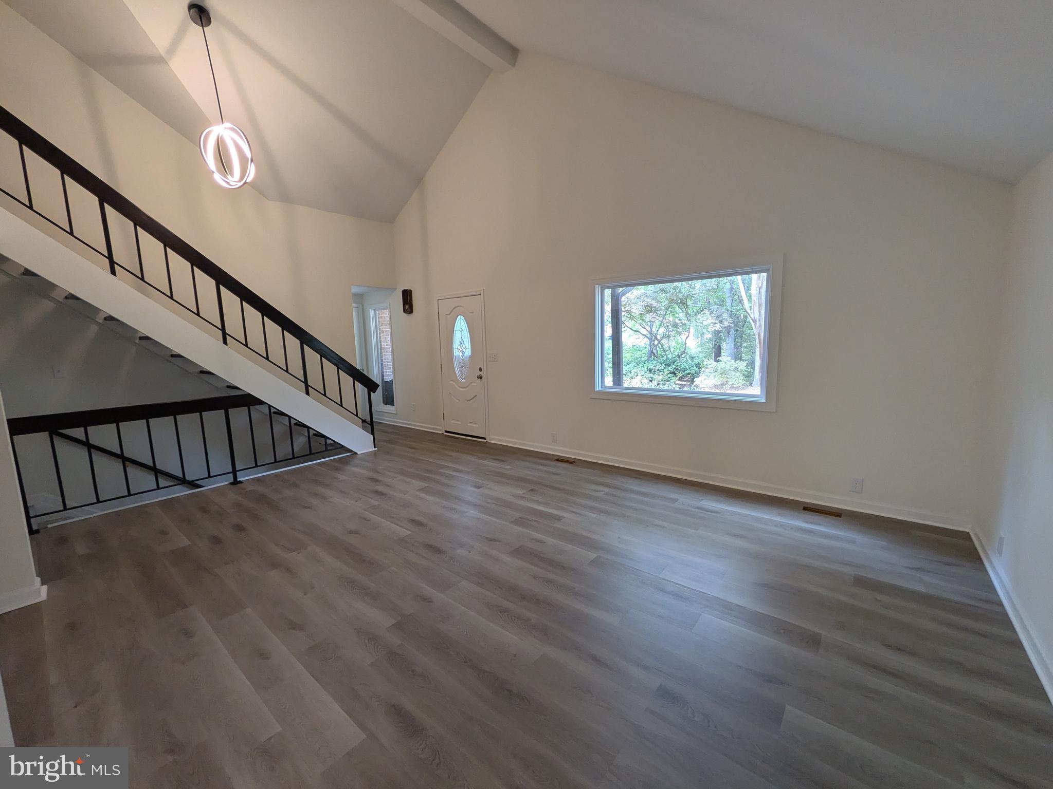 1019 Isabella Drive Stafford, VA 22554 - Photo 7 of 20 a view of entryway and hall with wooden floor