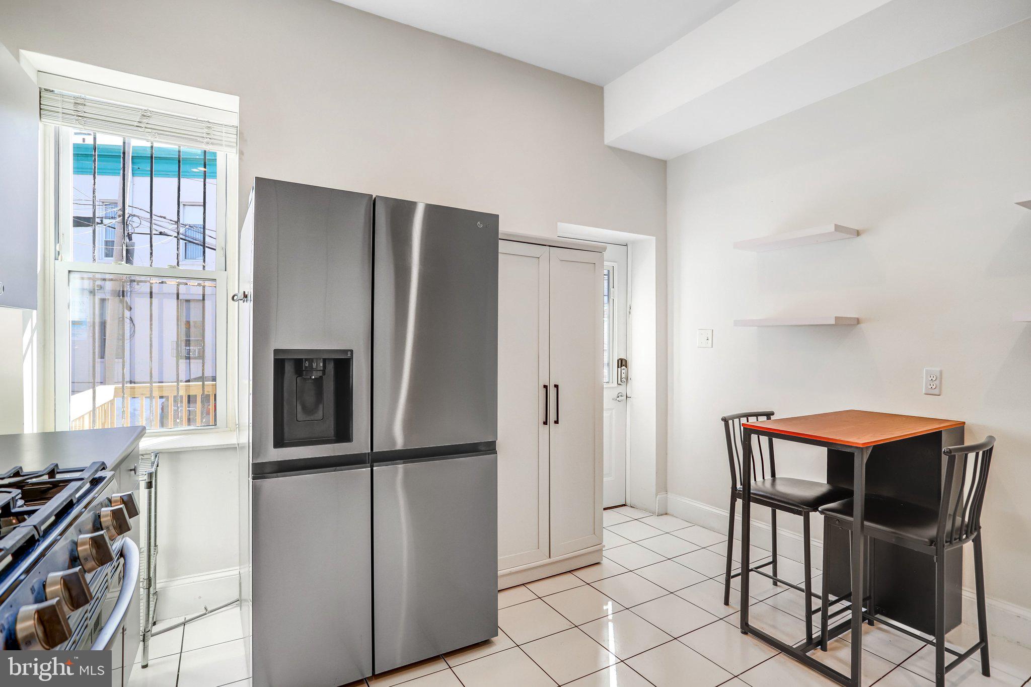 12 Rhode Island Avenue Northwest Washington, DC 20001 - Photo 21 of 74 a kitchen with stainless steel appliances a refrigerator and a stove top oven