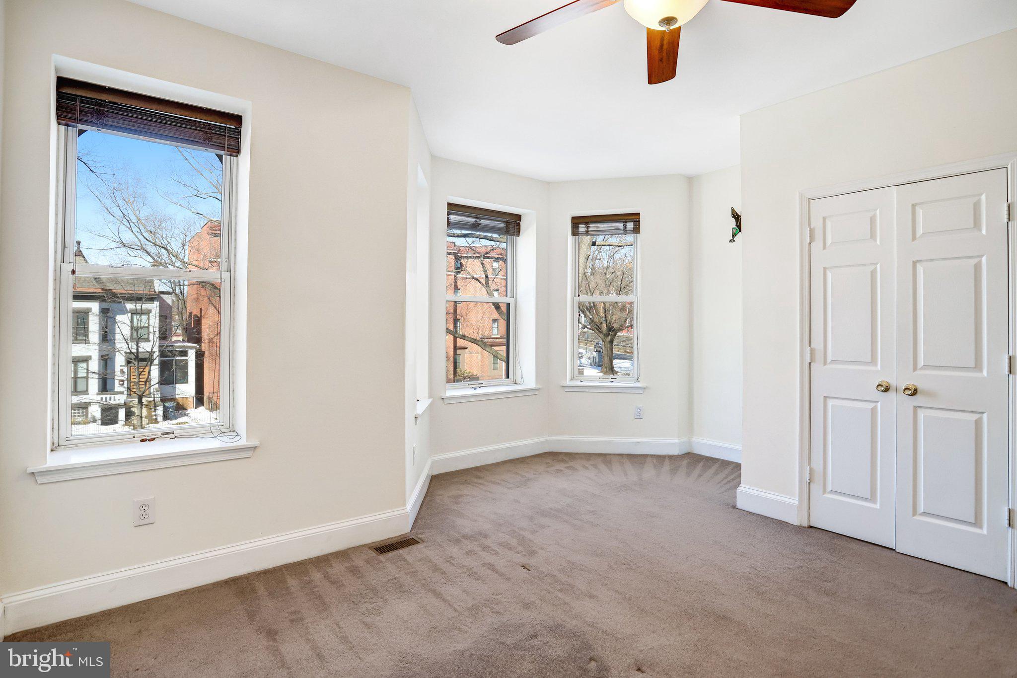 12 Rhode Island Avenue Northwest Washington, DC 20001 - Photo 28 of 74 an empty room with windows and fan