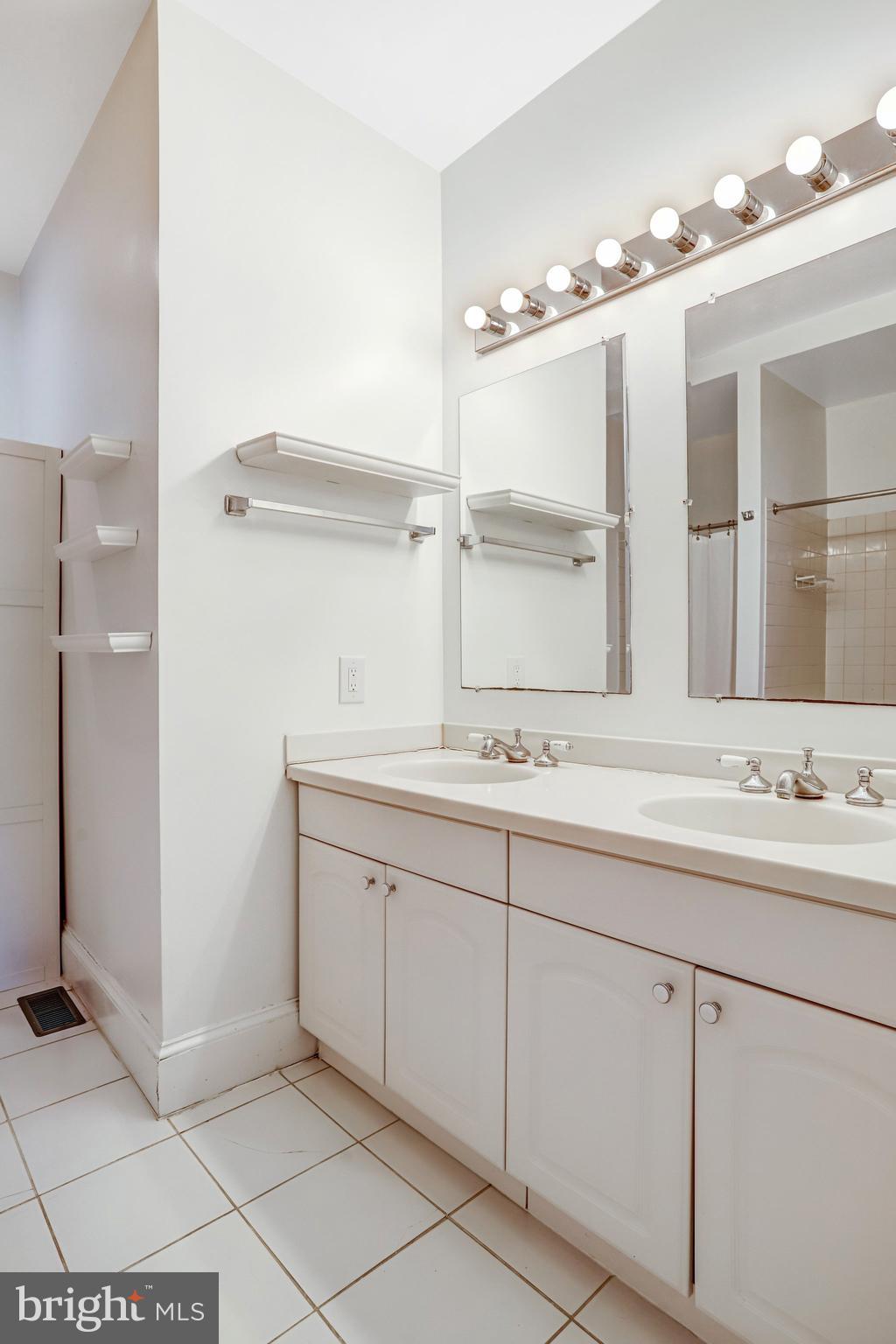 12 Rhode Island Avenue Northwest Washington, DC 20001 - Photo 33 of 74 a bathroom with a double vanity sink mirror and double
