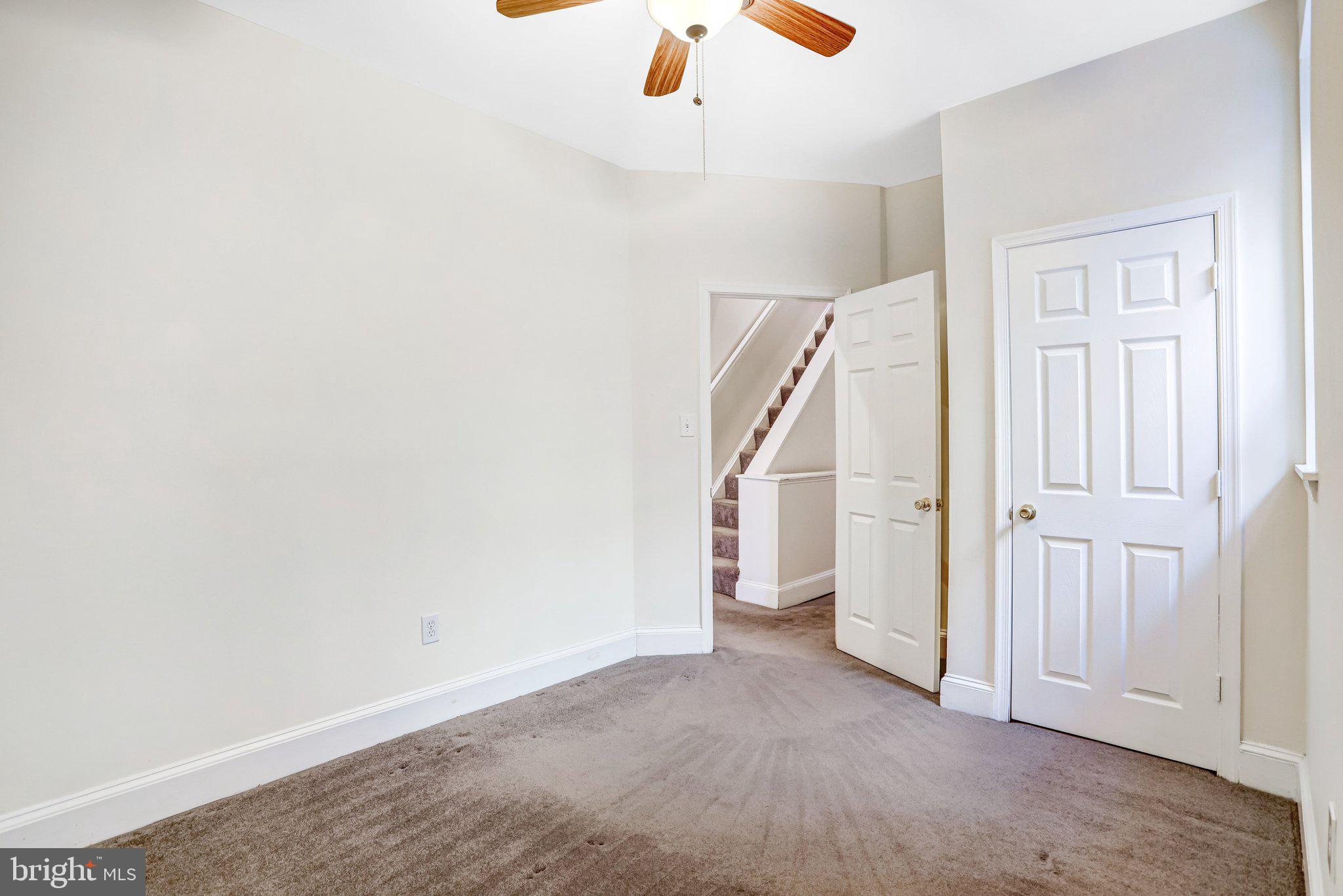 12 Rhode Island Avenue Northwest Washington, DC 20001 - Photo 38 of 74 an empty room with a ceiling fan and window