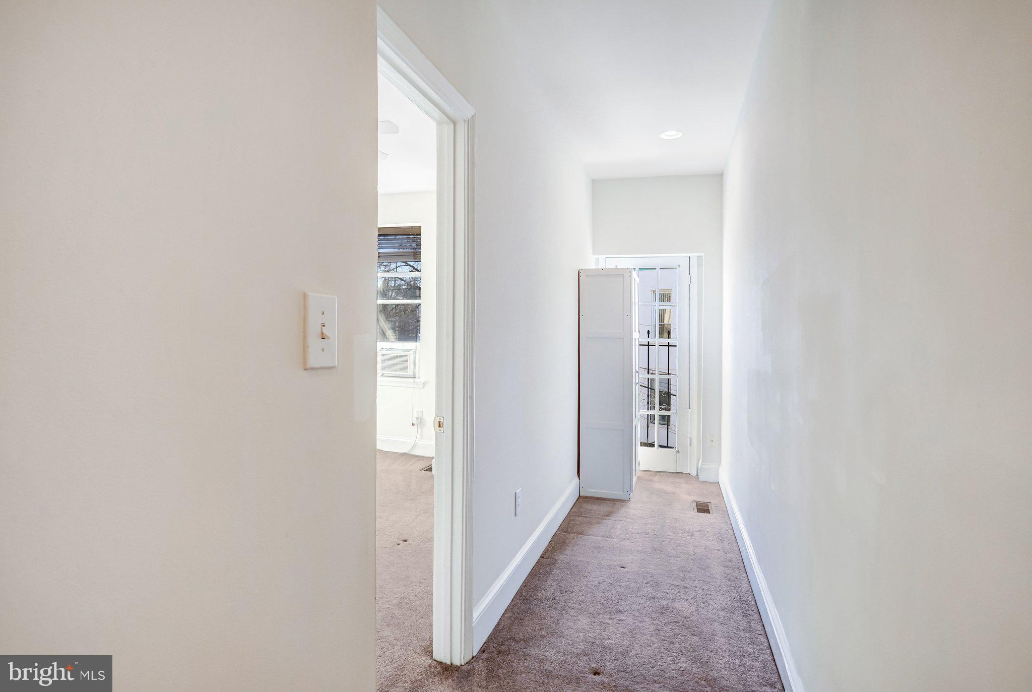 12 Rhode Island Avenue Northwest Washington, DC 20001 - Photo 42 of 74 a view of a hallway with wooden shelves