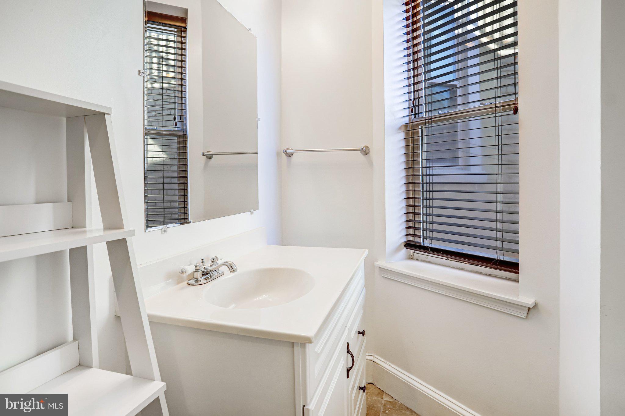 12 Rhode Island Avenue Northwest Washington, DC 20001 - Photo 43 of 74 a bathroom with a sink and a mirror