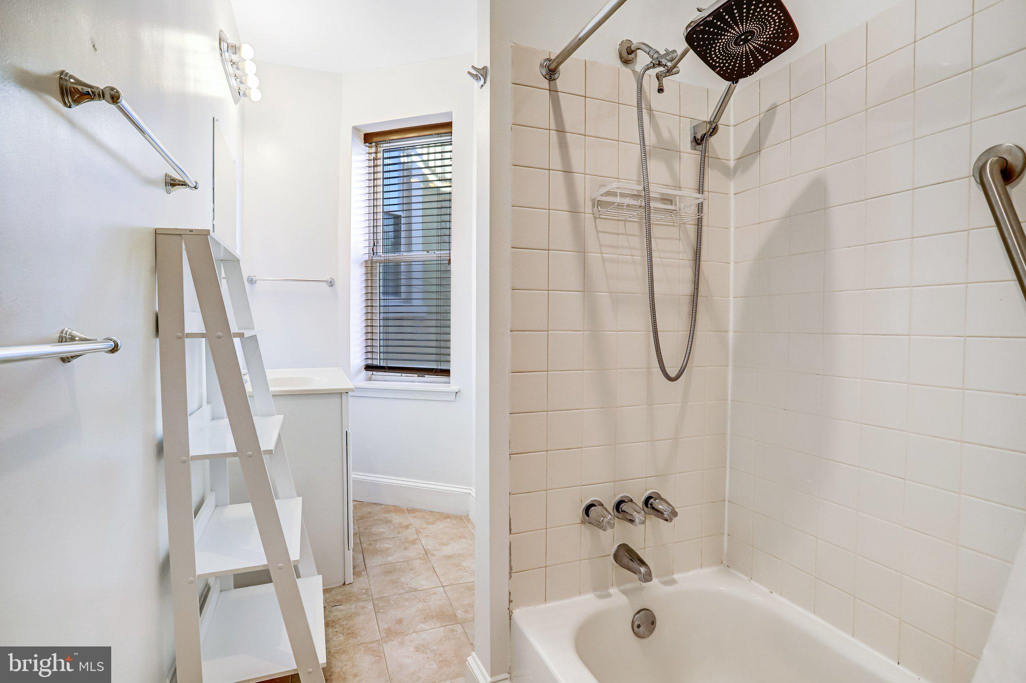 12 Rhode Island Avenue Northwest Washington, DC 20001 - Photo 44 of 74 a bathroom with a shower and a tub