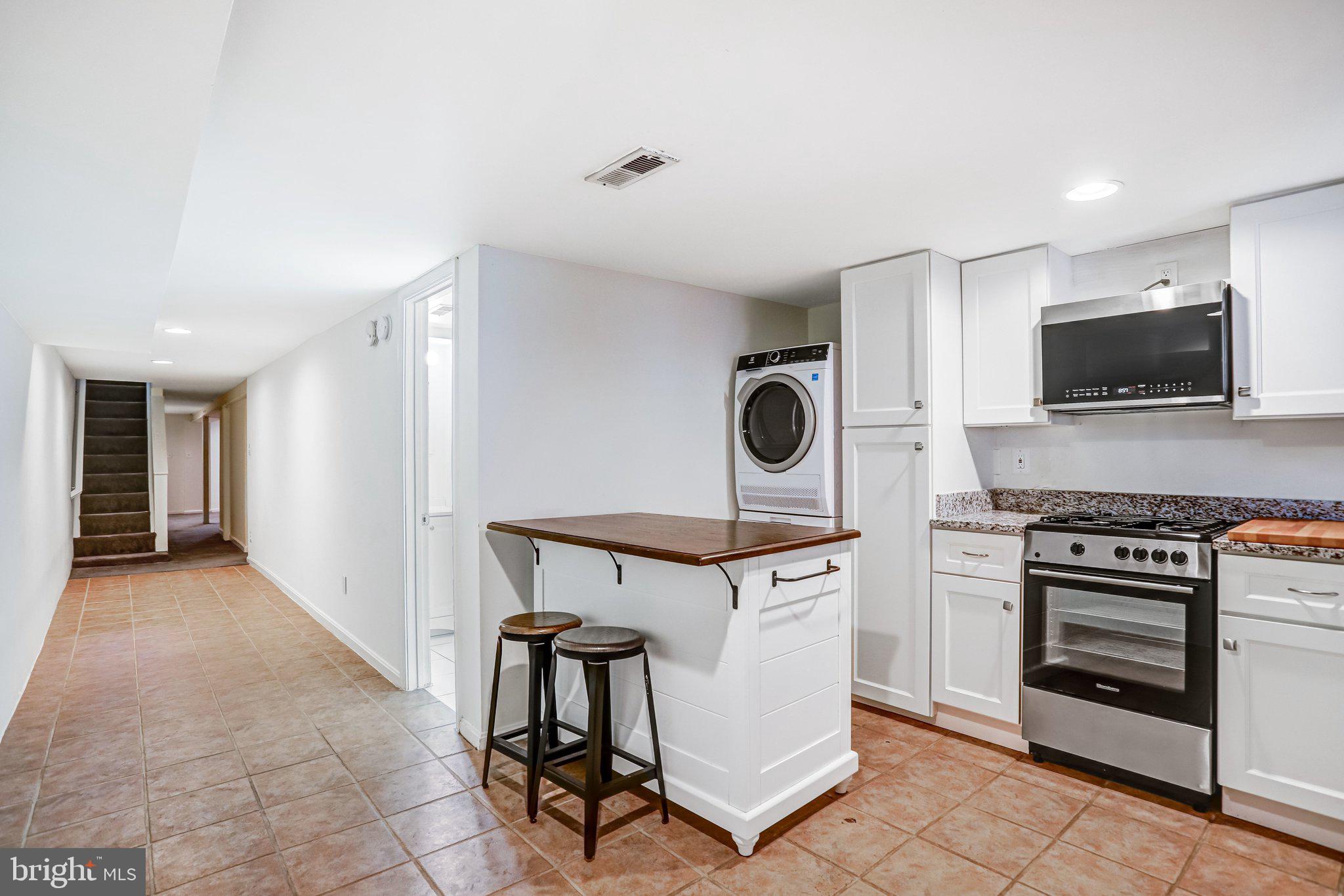 12 Rhode Island Avenue Northwest Washington, DC 20001 - Photo 67 of 74 a kitchen with a stove and a refrigerator