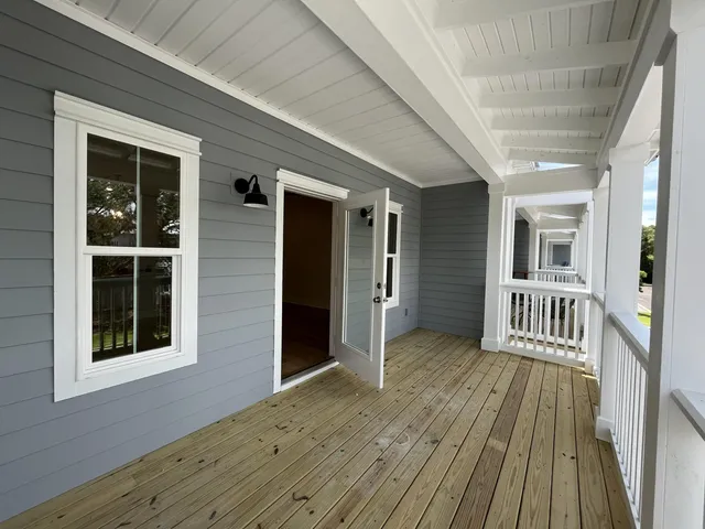 a view of a porch with wooden floor and outdoor space