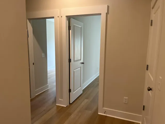 a view of a bathroom with wooden floor