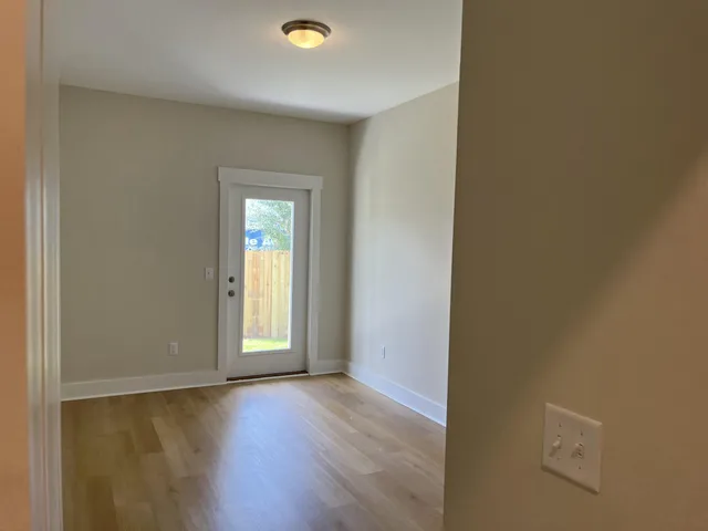 a view of a livingroom with wooden floor