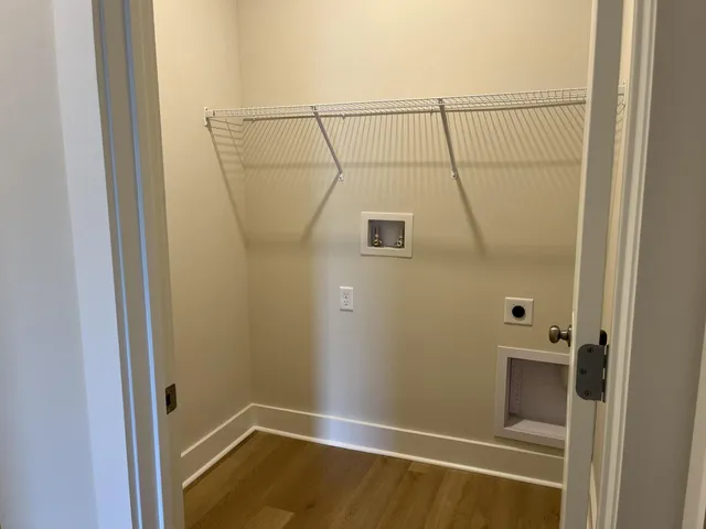 a view of gallery with wooden floor