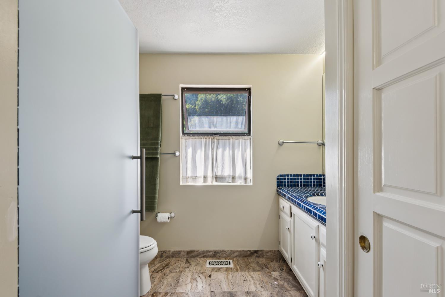 1475 Los Olivos Road Santa Rosa, CA 95404 - Photo 28 of 51 a bathroom with a sink and a toilet