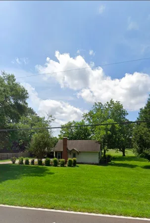 a view of a garden and basketball court