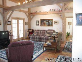 2301 North River Road Tryon, NC 28782 - Photo 2 of 12 a living room with furniture and a fireplace