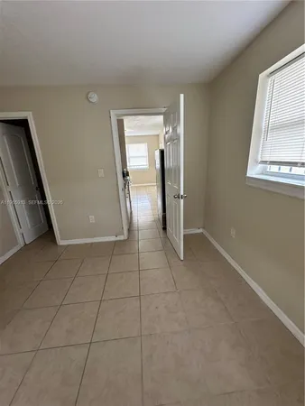 a view of an empty room and window