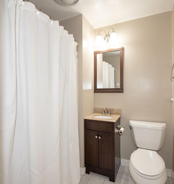 195 Kaleva Road Lancaster, MA 01523 - Photo 19 of 39 a bathroom with a toilet a sink and mirror