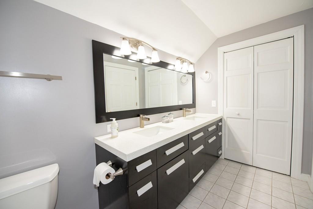 195 Kaleva Road Lancaster, MA 01523 - Photo 24 of 39 a bathroom with a double vanity sink mirror and toilet