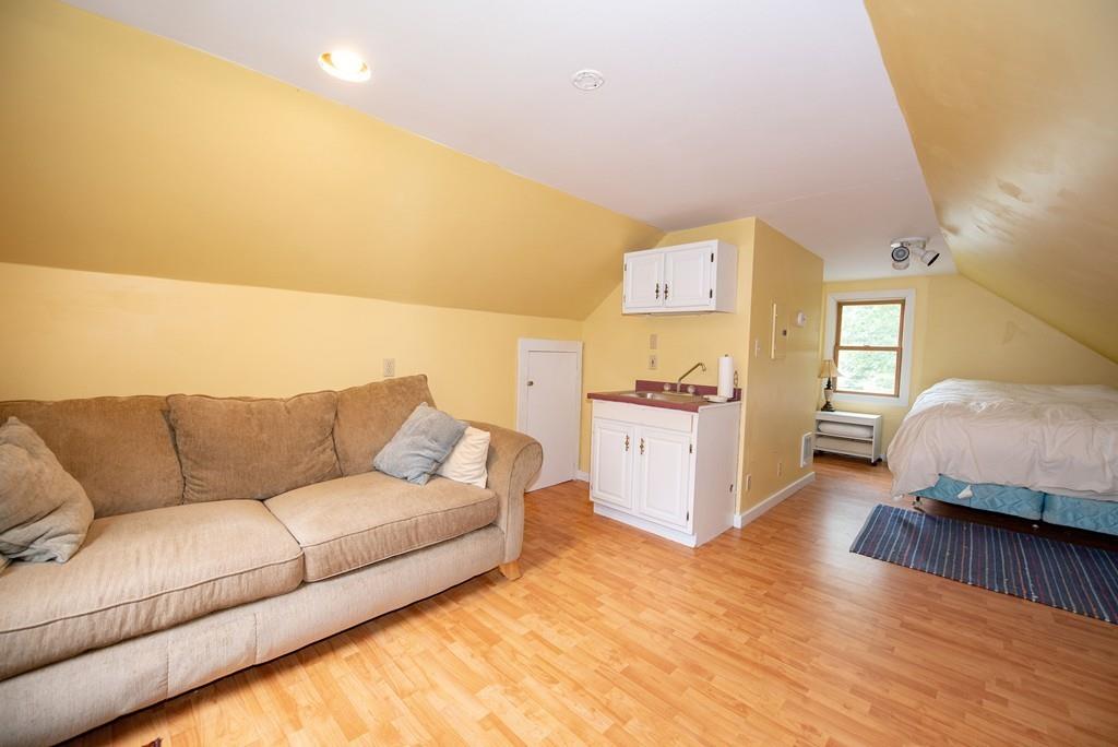 195 Kaleva Road Lancaster, MA 01523 - Photo 29 of 39 a living room with furniture and a wooden floor