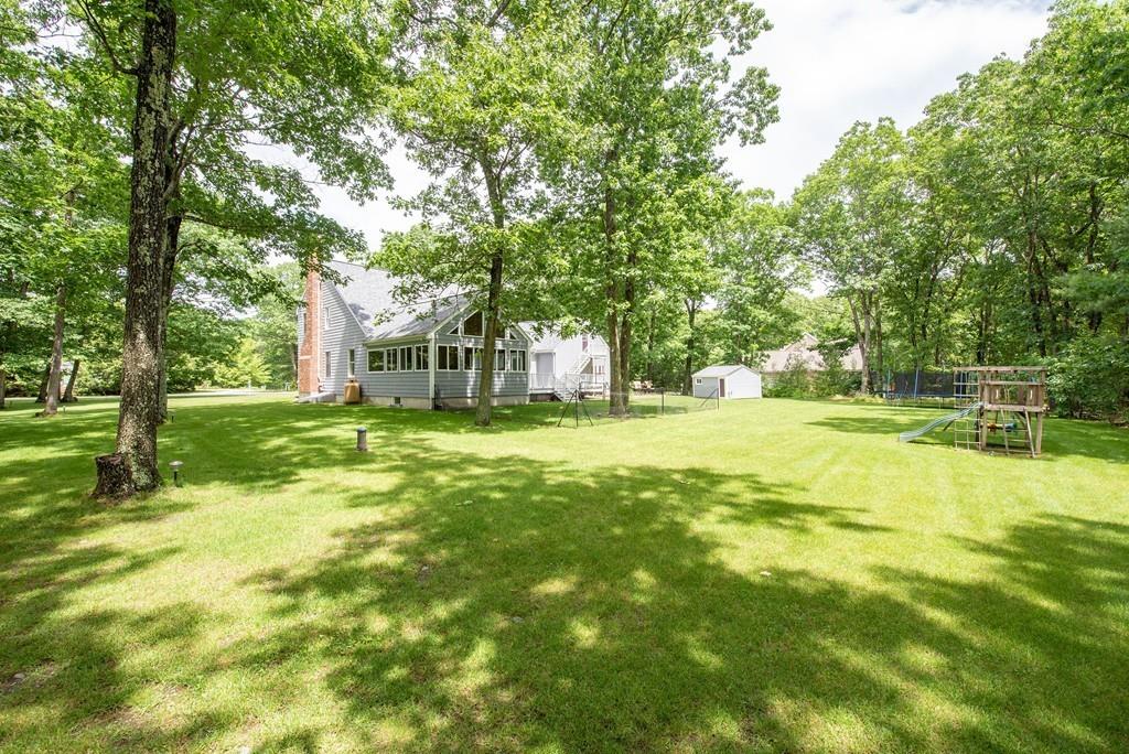 195 Kaleva Road Lancaster, MA 01523 - Photo 36 of 39 a swimming pool with trees in the background