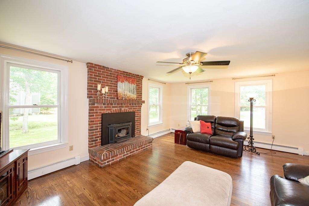 195 Kaleva Road Lancaster, MA 01523 - Photo 9 of 39 a living room with furniture window and a fireplace