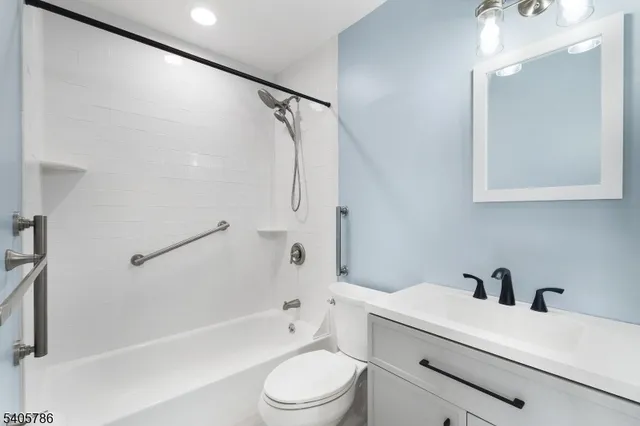 a bathroom with a sink a toilet and a bathtub