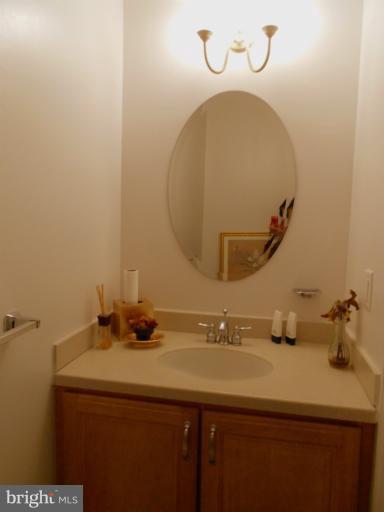 1260 Columbia Road Northwest Washington, DC 20009 - Photo 11 of 19 a bathroom with a sink and a mirror