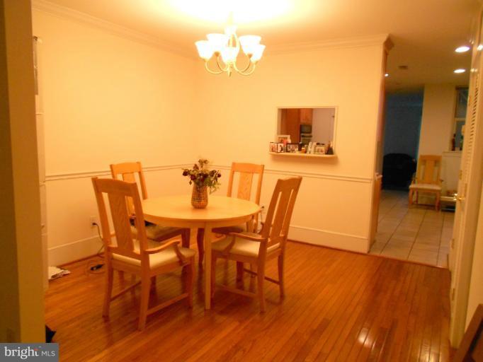 1260 Columbia Road Northwest Washington, DC 20009 - Photo 13 of 19 a view of a dining room with furniture and wooden floor