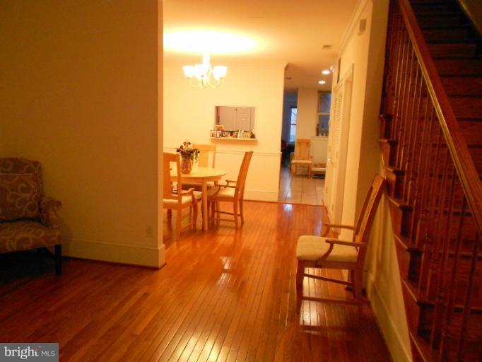 1260 Columbia Road Northwest Washington, DC 20009 - Photo 8 of 19 a dining room with furniture and wooden floor