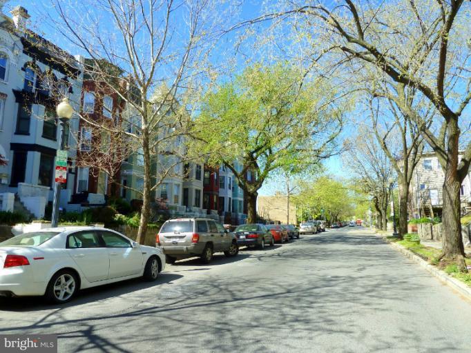 1260 Columbia Road Northwest Washington, DC 20009 - Photo 10 of 19 a view of street with parked cars